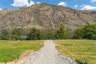.84 of an acre with 100 ft of waterfront. This is the private access trail to the waterfront.