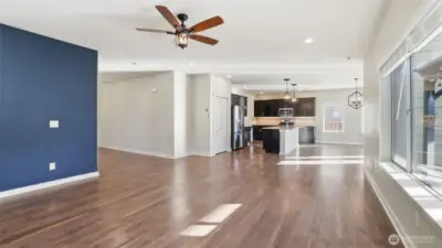 Open floor plan offers effortless connection between kitchen, dining, and living areas.