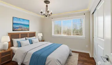 Bedroom on upper level offers inlaid lighting. (virtually staged)