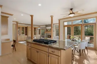 Open-concept kitchen with center island and seamless flow into the family room.