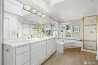 Spa-inspired primary en-suite featuring dual vanities, soaking tub, separate shower, and abundant natural light. Featuring second walk in closet.