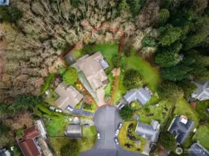 Aerial view highlighting the generous .41-acre property boundaries, tucked at the end of a quiet cul-de-sac with wooded privacy behind the home.