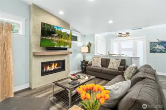 Spacious living area with modern fireplace, recessed lighting, and clean contemporary finishes designed for comfort and easy living.