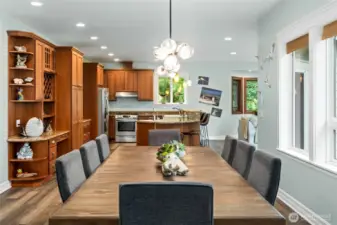 Bright open-concept dining and kitchen layout, ideal for entertaining and everyday living with seamless flow between gathering spaces.