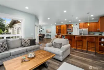 Spacious open-concept living area seamlessly connects the living room, dining area, and kitchen—perfect for entertaining and everyday comfort.