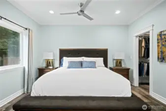 Large primary suite with ample natural light and easy flow to the en-suite bathroom and walk-in closet.