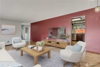 Large, open living room offers flexible space for entertaining while maintaining a warm and inviting atmosphere. **VIRTUALLY SATAGED**