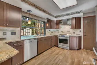 Beautiful granite countertops and warm wood cabinetry create a timeless and inviting cooking space.