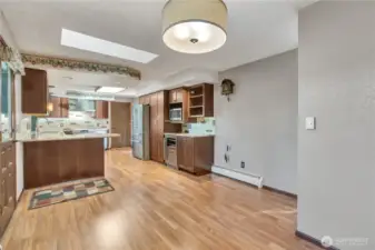 Another view of the large dining room area and the breakfast bar.
