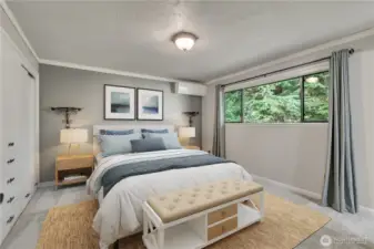 Spacious primary suite offers a peaceful retreat with large windows and plenty of room for relaxing. **VIRTUALLY STAGED**