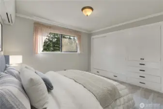Comfortable secondary bedroom with natural light and built-in storage, perfect for guests or family. **VIRTUALLY STAGED**