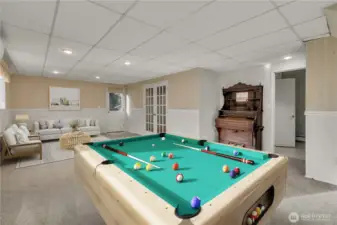Large recreation room provides endless possibilities—perfect for a game room, media space, entertaining guests or possible ADU. The exit door to the outside and additional 4th bedroom to the right (was used as a den) and adjacent remodeled 3/4 bathroom would make a perfect set-up! **VIRTUALLY STAGED**