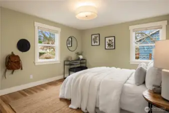 The primary bedroom located on the main floor easily handles a king sized bed and boasts southwest exposure for great natural light.