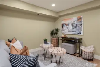 The lower level has LVP flooring and a tidy rec room that makes for a great tv room or home office area.