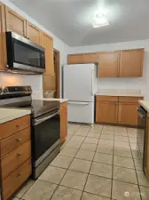 Newer stove, microwave, and dishwasher.