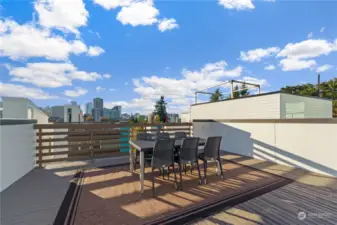 Roof top deck with lots of sitting spaces and city views