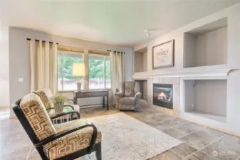Wonderful living space with gas fireplace & cutouts for media/books/art/tv-you decide.