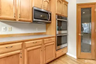 Kitchen features double oven, built-in microwave and pantry.