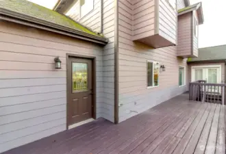 Back deck with door from alcove off the kitchen.