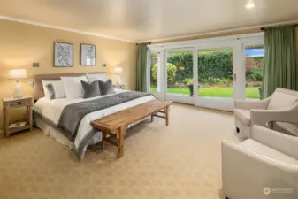 Large Primary Bedroom comfortably holds a king size bed and lots of extra seating and storage. Quality sliding windows and doors let all the natural beauty in. Built in speakers and custom lighting are found here, too.