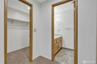 ~ Primary Suite Walk - In Closet ~  There is an additional linen closet on the right off private half bath. *