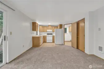 ~ View of kitchen area ... Closed door on right is a nice size pantry.  Open door on right is laundry area & access to attached two car garage. ~