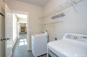 Main floor laundry/utility room offers easy garage access through a second door.