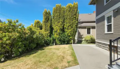 Pleasant back patio with privacy plantings.