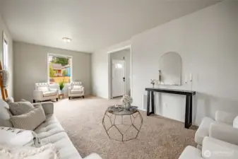 Living room has several windows for good light.