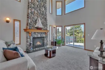 Living room with lake views opens to huge deck