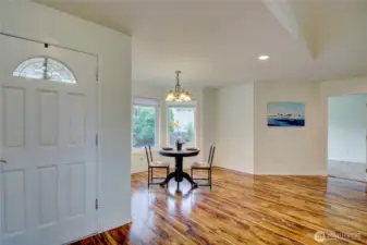 Main Entry opens to bright main floor living space at the heart of the home.