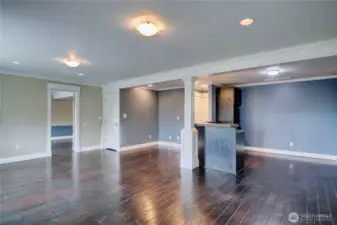 Bonus room with kitchenette. Doorway to upstairs creating a separate space.