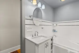 Main bath, mostly tile, jetted tub.