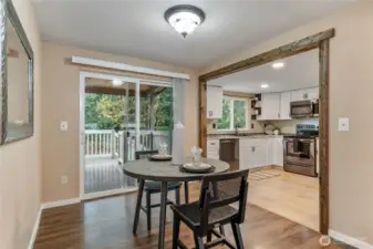 Dining room adjacent to kitchen with access to covered back deck