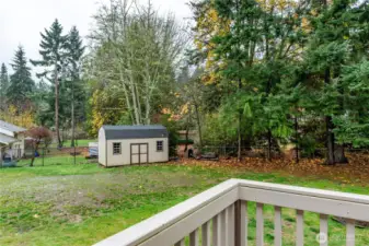 View of back yard. There is almost 75' from the front gate to the shed. Plenty of room for boats or RV's