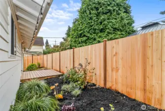View of the new fence and porch in the cute backyard