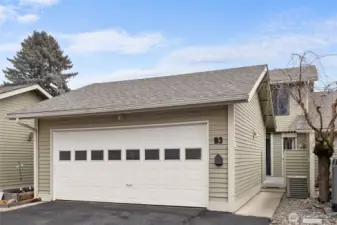 A two car attached garage provides covered parking and storage/workspace.