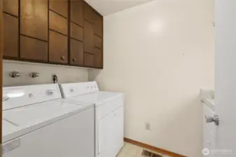 Utility room on main floor has loads of storage. Washer and dryer are included.