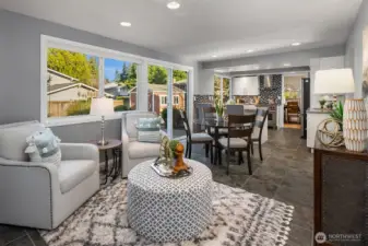 The great room/flex space overlooks the backyard and features double-pane windows and recessed lighting.