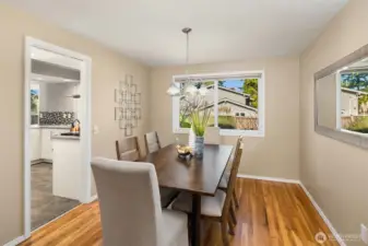 The kitchen connects to the dining room and includes a pocket door for added privacy.