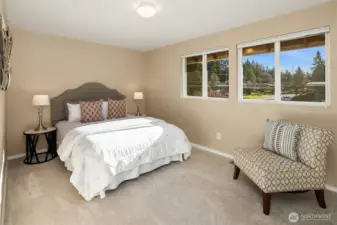 The second of four upper-level bedrooms is spacious and filled with natural light.