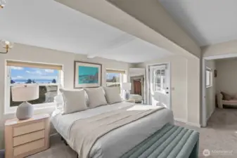 Primary suite with fireplace, ensuite bath, walk-in closet, and laundry