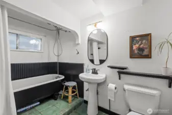 Secondary bathroom with claw foot tub.