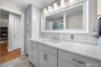Main bath with large walk in shower and Quartz counters