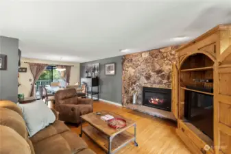 Beautiful stone gas fireplace with a Heat and Glo insert. Raised hearth. Beautiful hardwood floors. Dining off kitchen and living room. Large view windows.