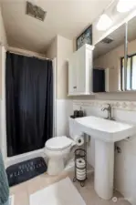 Bath off master suite with a pedestal sink and walk in shower. Tile floors