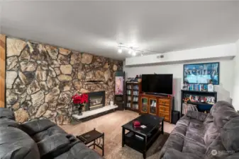 Surprise! Daylight basement with huge storage room, large game area and TV entertainment area with large stone fireplace. Has the Heat and Glo insert and raised hearth. Door to back yard.