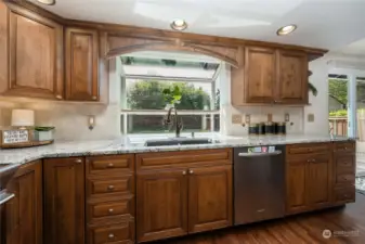 beautiful kitchen with high end granite counters, SS appliance a real wood luxury cabinets