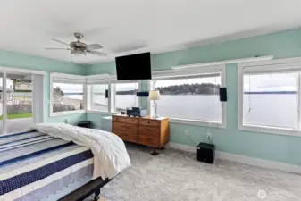 The primary bedroom is nestled on the lower level and enjoys expansive marine views on the daily.