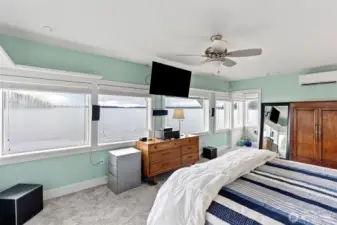 Imagine waking up to the ever-changing views enjoyed from this primary suite. (The window to the left is being replaced)